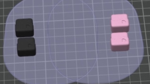 Two black and two pink keycaps spaced apart on a Bambu Studio build plate, with the tool head clearance circles drawn around them