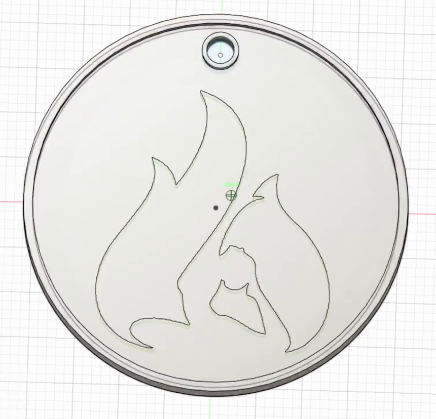 The extruded keychain body in Fusion 360 with the raised outer lip, the hole collar and the logo outlines